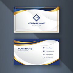 Obraz premium Elegant gold-blue business card design, dark background, contact info