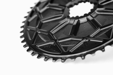Close up of a black oval bicycle chainring against white isolated background. Professional bicycle...