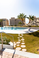 Modern hotel with swimming pool overlooking the city and the sea