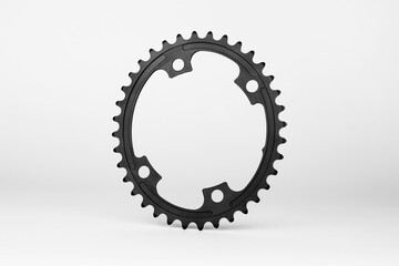 Black oval bicycle chainring against white isolated background, floating above the surface....