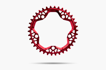 Red round bicycle chainring against white isolated background, floating above the surface....
