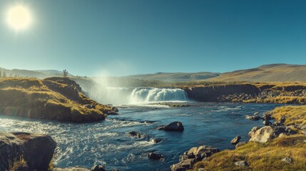 Obraz premium Scenic waterfall cascading into a river