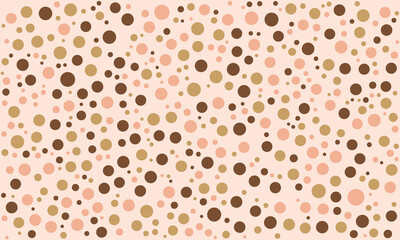 Peach and gold polka dot pattern, charming and playful pattern of varying sizes of circles in shades of light pink, beige gold, and dark brown, set against a soft light beige background.