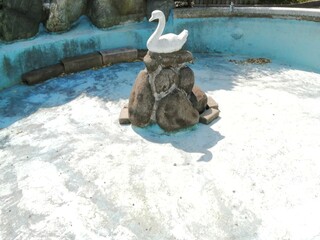 It says "Ube Shinkawa Station" in Japanese. Ube Shinkawa Station in Yamaguchi Prefecture, Japan is the station that appeared in the last scene of the movie "Evangelion: 3.0". It means that Evangelion 