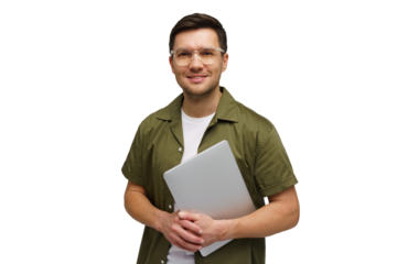 Young man smiling while holding a laptop in a studio setting during a bright morning session