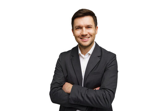 Smiling young man in a suit with arms crossed against a plain background