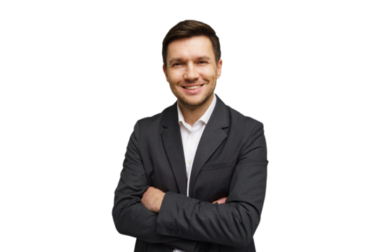 Smiling young man in a suit with arms crossed against a plain background