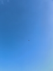 Fototapeta premium Small airplane flying in the clear blue sky of prague