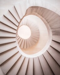 spiraling staircase inside a modern corporate building