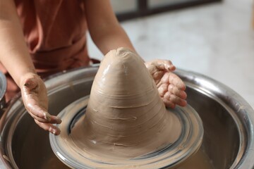 Hobby and craft. Girl making pottery indoors, closeup