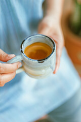 hand holding a cup of espresso shot..