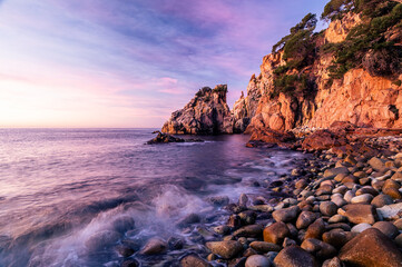 Amazing sunrise on the coastline of the Mediterranean Sea (Cala S'Agulla, Costa Brava - Spain)