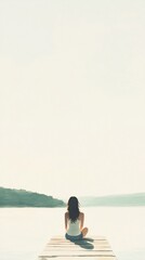 Fototapeta premium young woman enjoying peaceful lakeside moment, pastel green tones