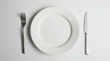 Minimalistic Table Setting with Empty White Ceramic Plate, Fork, and Knife on Bright Clean Background
