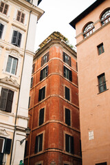 Three tall buildings and narrow streets between them