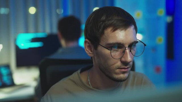 A close-up of a broadcast programmer analyzing data, embodying the essence of communication and technology in software development.