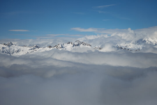 Madonna di Campiglio village covered in fog and clouds a ski resort in Italy. View of sunny winter in dolomites, alps. Madonna di Campiglio ursus snowpark in Val Rendena dolomites trentino Italy.
