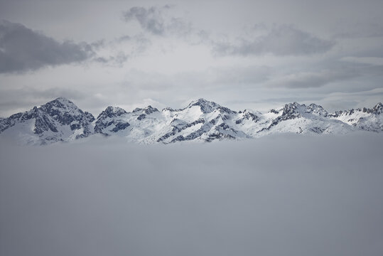 Madonna di Campiglio village covered in fog and clouds a ski resort in Italy. View of sunny winter in dolomites, alps. Madonna di Campiglio ursus snowpark in Val Rendena dolomites trentino Italy.