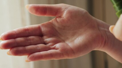 Close up of hands using apply antiseptic spray. Protection from bacterias and virus. Clean hands, hygiene and healthcare. High quality 4k footage