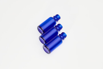 Blue glass jars without logos for mockups of medicines, vitamins, cosmetics