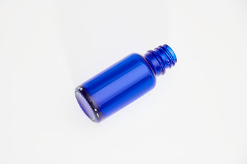 Blue glass jar without logos for mockup of medicines, vitamins, cosmetics