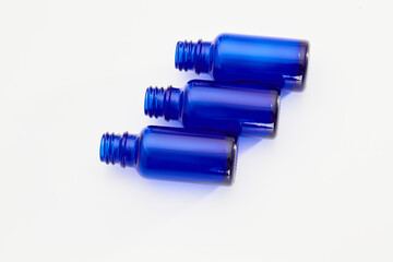 Blue glass jars without logos for mockups of medicines, vitamins, cosmetics
