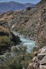 River mountain landscape, rocky banks, turquoise water of the river. Autumn
