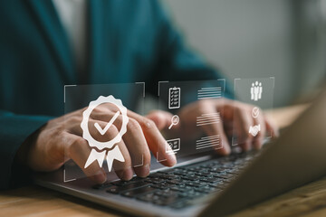 ISO certification and quality assurance, Businessman working with computer and tablet, symbolizing...