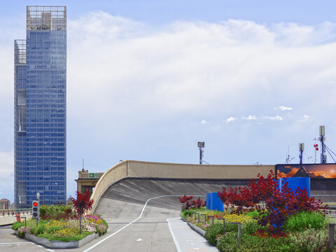the parabolic curve of the FIAT car test track on the roof of the Lingotto with skyscraper in the background.Turin - Italy, 03 March 2025