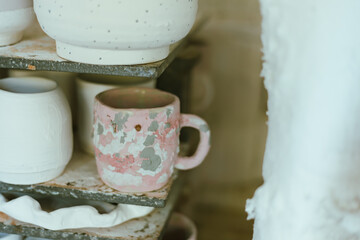 clay mugs in kiln for firing pottery
