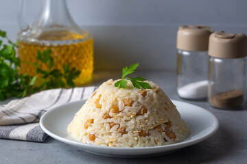 Traditional delicious Turkish food; Rice with chickpeas and chicken (Turkish name; Tavuklu nohutlu pilav or pilaf)