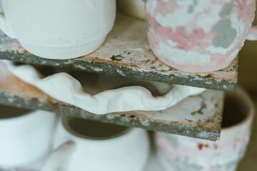clay mugs in kiln for firing pottery
