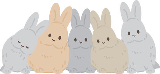 寄り添ってこちらを見るウサギたち
