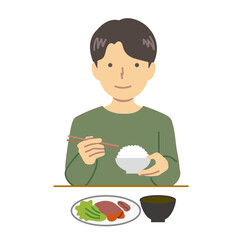 食事する男性：