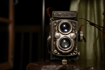 Old vintage camera on a black background