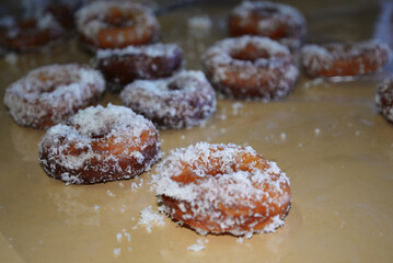 Homemade coconut top donuts on a table