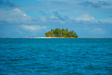 Tropical island emerging from the ocean in siargao, philippines