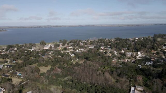 panning over the city next to Chascomus lagoon