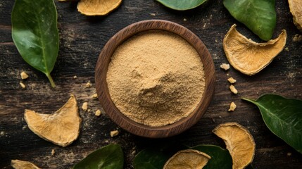 Bael fruit powder in a wooden bowl, surrounded by dried bael slices and leaves