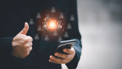 HRM, Human Resource Management, man use magnifier for search manager icon which is among staff...