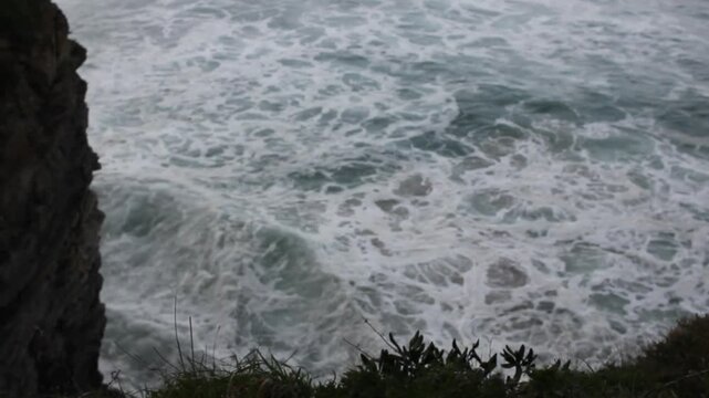 Os Castros beach at sunset with big waves, Ribadeo, Spain