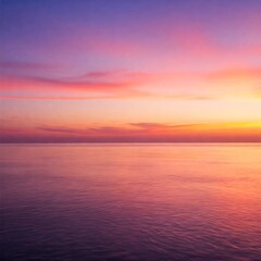 Fototapeta premium Breathtaking Sunset Over a Calm Ocean with the Sky Painted in Warm Colors