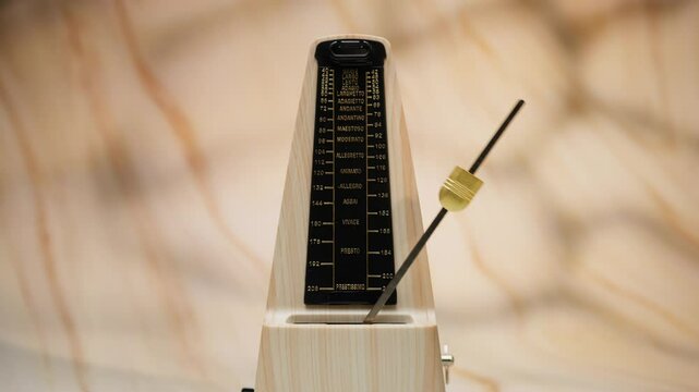 Classic metronome against a minimalist background