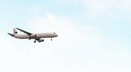 ULTRA HD. Airplane flies in blue sky. Travel. Airplane takes off against the background of blue sky.	