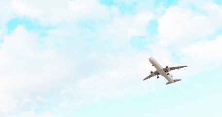 ULTRA HD. Airplane flies in blue sky. Travel. Airplane takes off against the background of blue sky.	