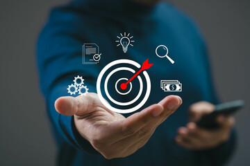 A focused person targets goals with precision, symbolizing ambition and strategy for success in a...
