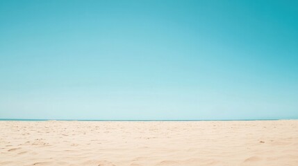 Spacious beach view with soft sand dunes and clear blue sky ideal for relaxation and enjoyment