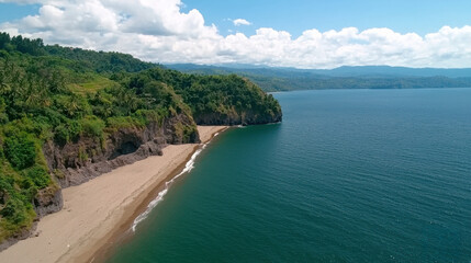 Obraz premium Secluded Tropical Beach Aerial View Lush Green Cliffs and Dark Sand Meet Turquoise Ocean