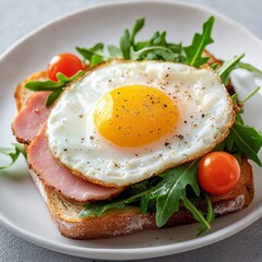 Delicious Breakfast Toast: Sunny-Side Up Egg, Ham, and Arugula Salad on Sourdough Bread with Cherry Tomatoes