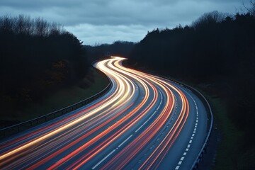 Dynamic highway at night with blurred car lights creating vibrant streaks under a cloudy sky and dark forest in the background for a sense of speed